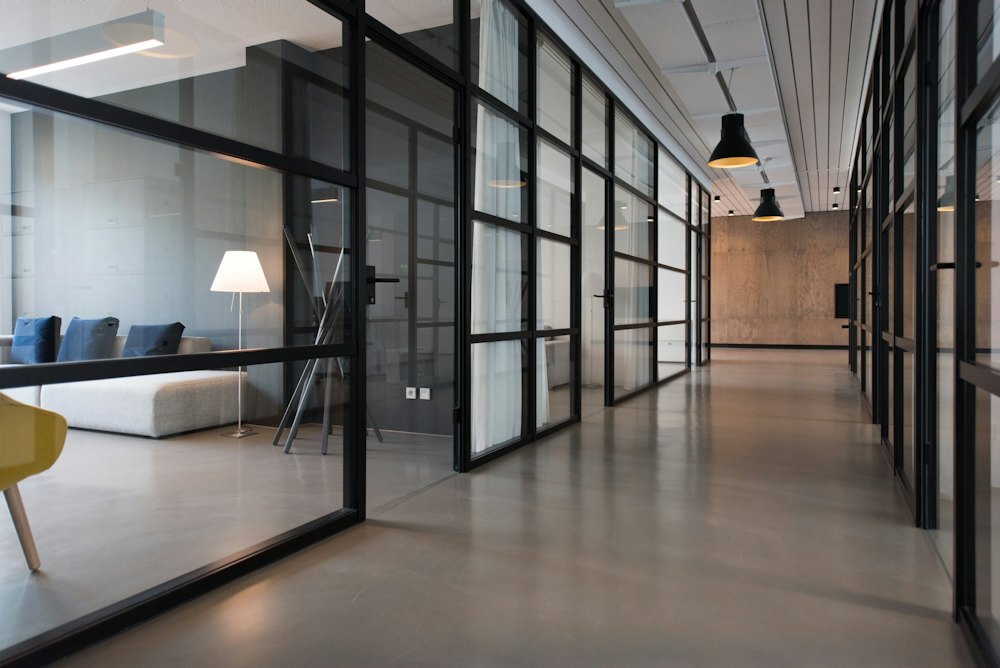 Glass-walled office corridor